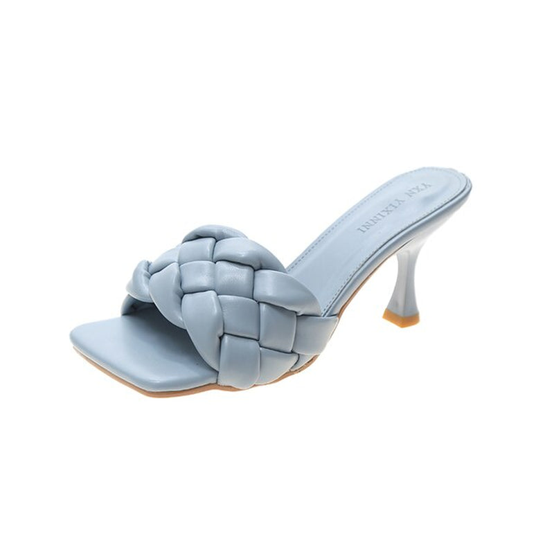 Stylish blue high-heeled mules with intricate weave design, ideal for office or prom wear.